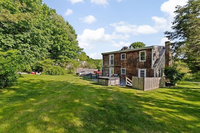 67 Greenfield Ln, Scituate, MA 02066 - rear view of house with a chimney and a yard