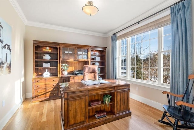 office with baseboards, ornamental molding, and light wood-style floors