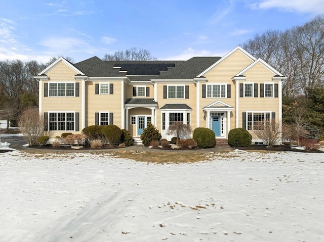 view of front of home featuring roof mounted solar panels