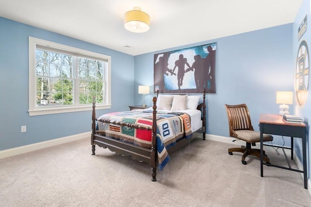 carpeted bedroom with visible vents and baseboards