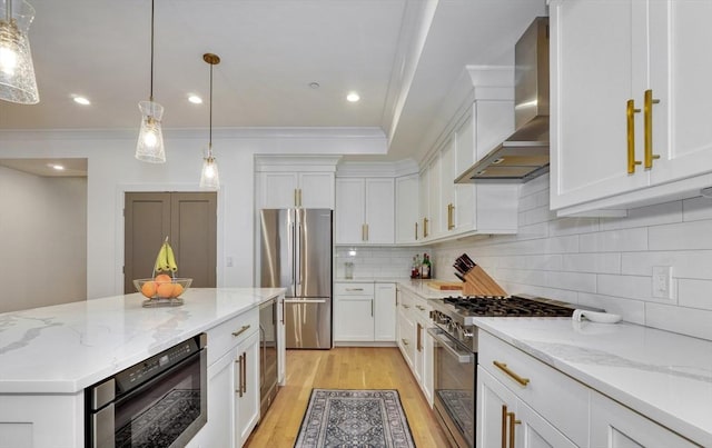 11 Conway St Unit 3, Boston, MA 02131 - kitchen with appliances with stainless steel finishes, wall chimney exhaust hood, light wood-style floors, white cabinets, and ornamental molding