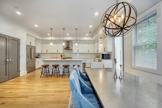 11 Conway St Unit 3, Boston, MA 02131 - dining room featuring light wood finished floors, a chandelier, ornamental molding, and recessed lighting