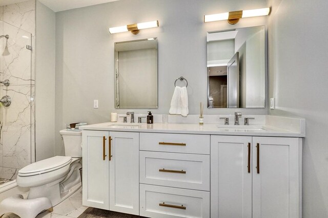 11 Conway St Unit 3, Boston, MA 02131 - bathroom featuring toilet, a marble finish shower, marble finish flooring, and double vanity
