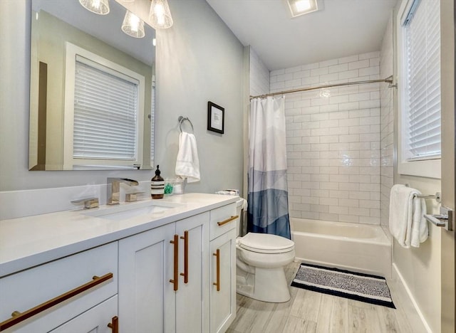 11 Conway St Unit 3, Boston, MA 02131 - bathroom featuring wood finished floors, vanity, toilet, and shower / tub combo with curtain