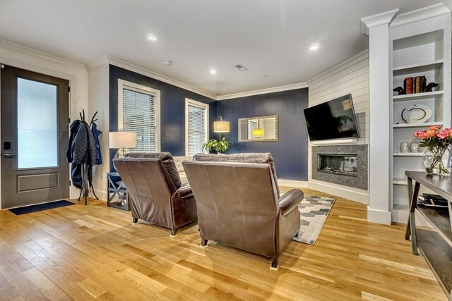 11 Conway St Unit 3, Boston, MA 02131 - living room with light wood finished floors, ornamental molding, a large fireplace, recessed lighting, and built in shelves
