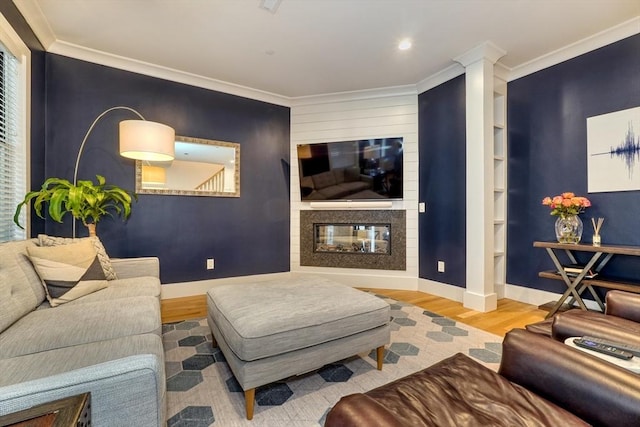 11 Conway St Unit 3, Boston, MA 02131 - living room with wood finished floors, a multi sided fireplace, baseboards, crown molding, and recessed lighting