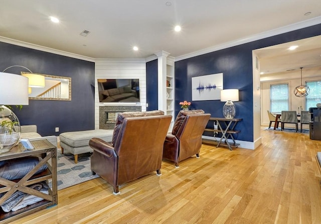 11 Conway St Unit 3, Boston, MA 02131 - living room with light wood-style flooring, baseboards, crown molding, recessed lighting, and a fireplace