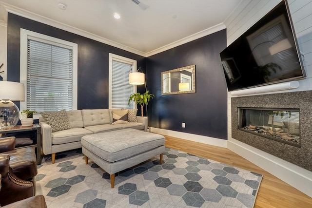 11 Conway St Unit 3, Boston, MA 02131 - living room featuring wood finished floors, a multi sided fireplace, ornamental molding, baseboards, and recessed lighting
