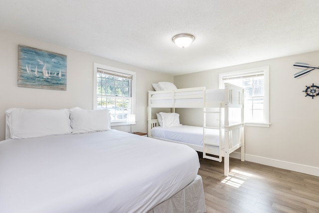 bedroom with hardwood / wood-style flooring