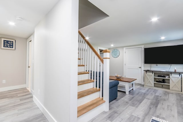 stairway featuring wood-type flooring