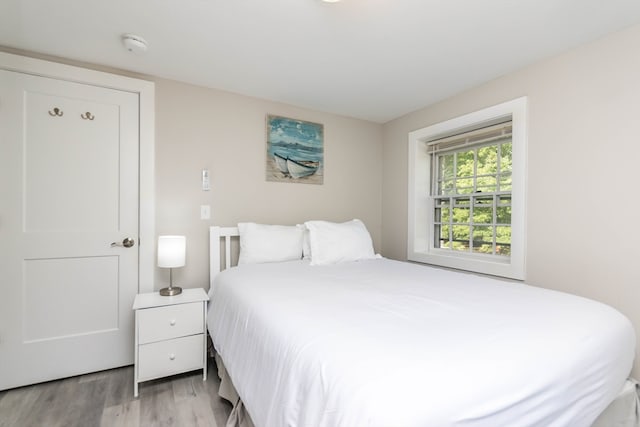 bedroom with light hardwood / wood-style floors