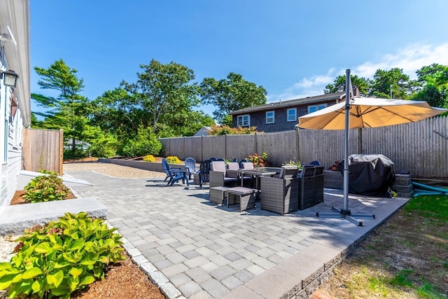 view of patio featuring a grill