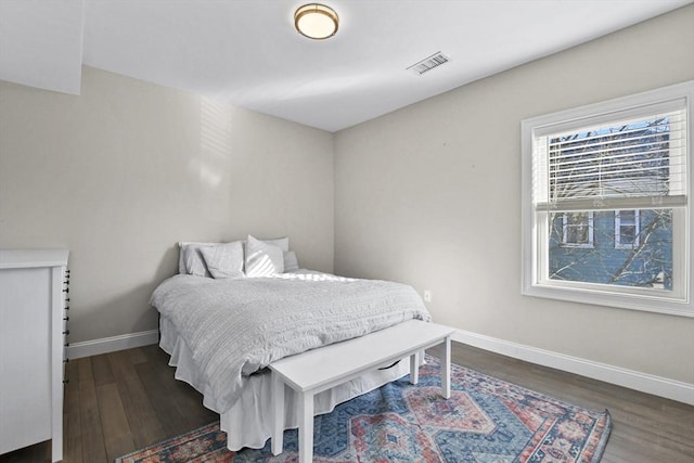 bedroom featuring dark hardwood / wood-style flooring