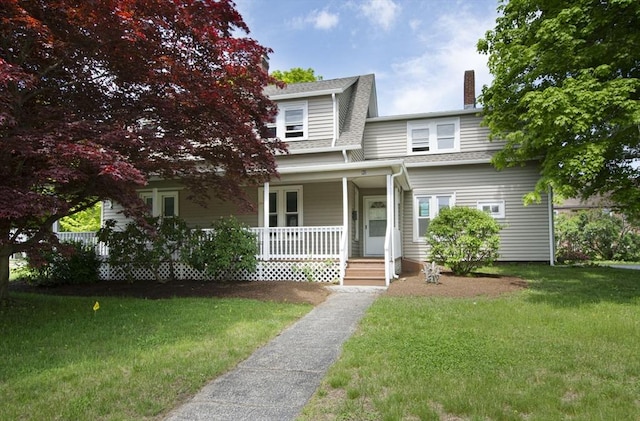 view of front facade with a porch and a front yard