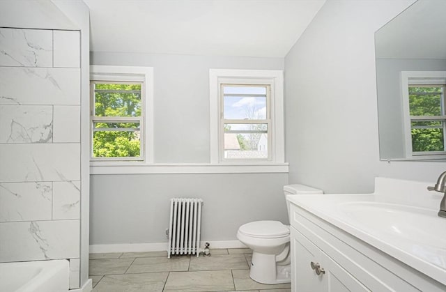 full bathroom featuring bathtub / shower combination, vanity, toilet, and radiator