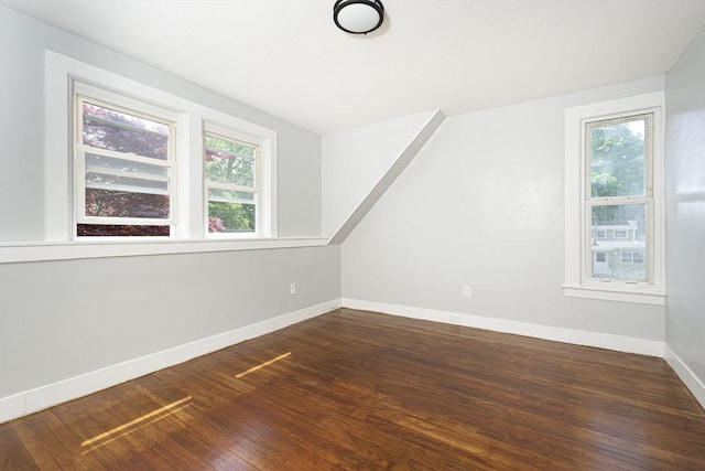 bonus room featuring dark wood-type flooring