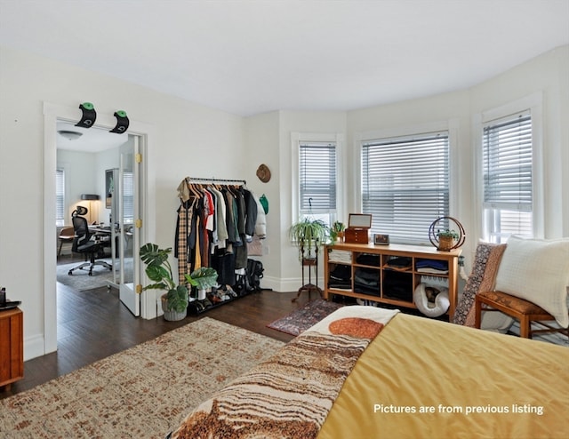 bedroom featuring dark wood-type flooring