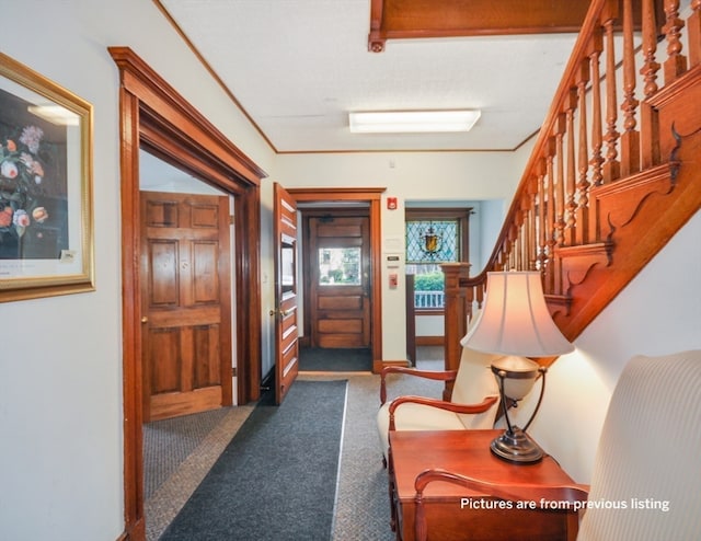 corridor with dark colored carpet