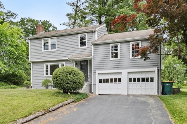 6 Cherry Ridge Rd, Acton, MA 01720 - view of front facade with an attached garage, a chimney, asphalt driveway, and a front lawn