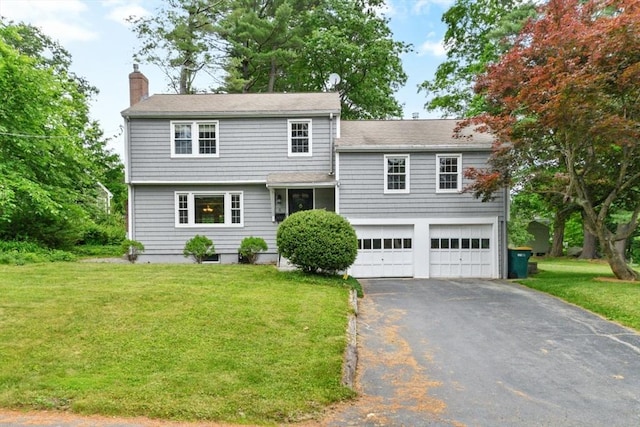 6 Cherry Ridge Rd, Acton, MA 01720 - view of front facade featuring a chimney, asphalt driveway, a garage, a front lawn, and roof with shingles