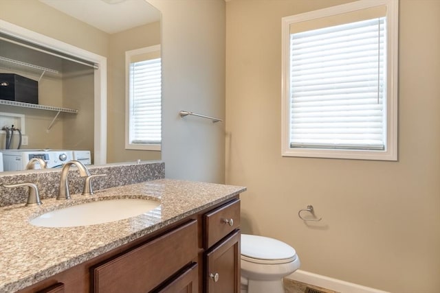 bathroom with vanity and toilet