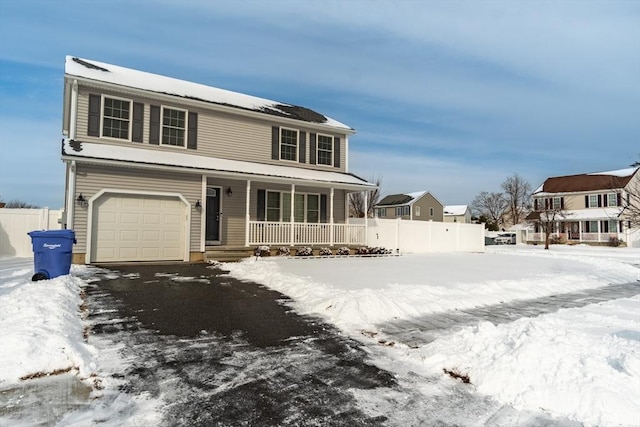 view of front of home with a garage and covered porch