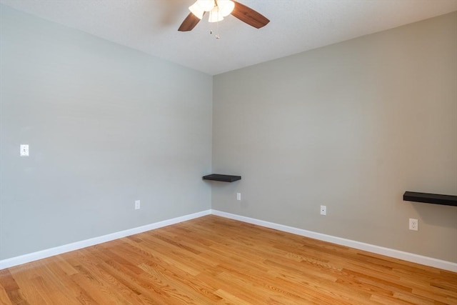 spare room with ceiling fan and light hardwood / wood-style flooring