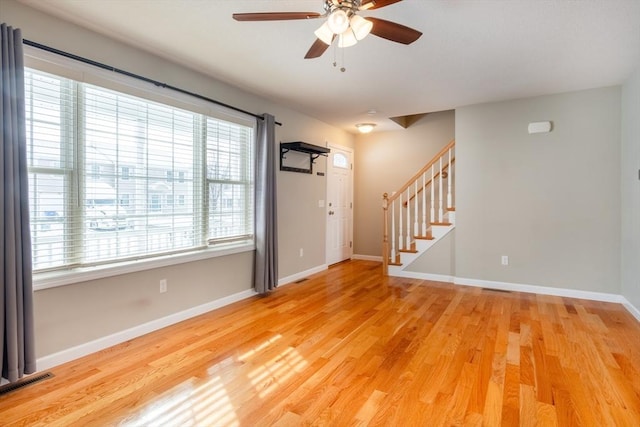 foyer featuring hardwood / wood-style flooring and ceiling fan