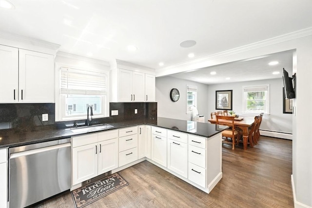77 Marblehead St, North Reading, MA 01864 - kitchen with dishwasher, a sink, a baseboard heating unit, a peninsula, and wood finished floors