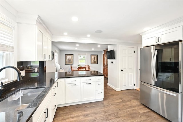 77 Marblehead St, North Reading, MA 01864 - kitchen featuring smart refrigerator, a sink, a peninsula, white cabinetry, and wood finished floors