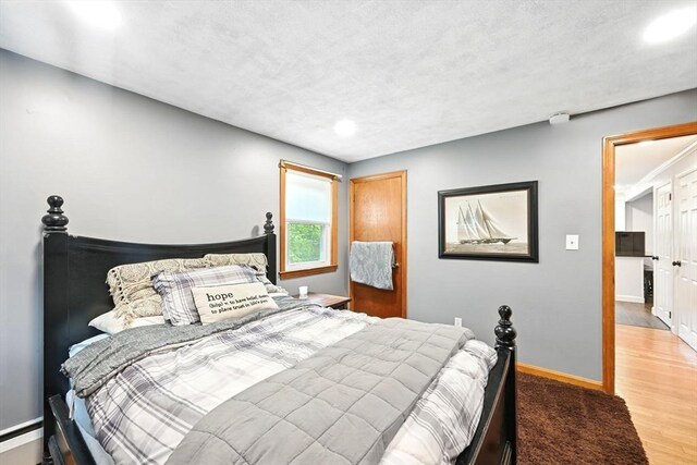 77 Marblehead St, North Reading, MA 01864 - bedroom with wood finished floors, recessed lighting, and baseboards