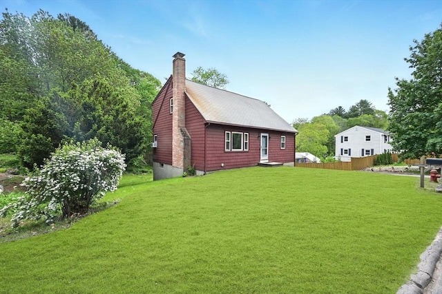77 Marblehead St, North Reading, MA 01864 - view of property exterior with a chimney