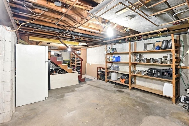 77 Marblehead St, North Reading, MA 01864 - unfinished below grade area featuring freestanding refrigerator and stairs