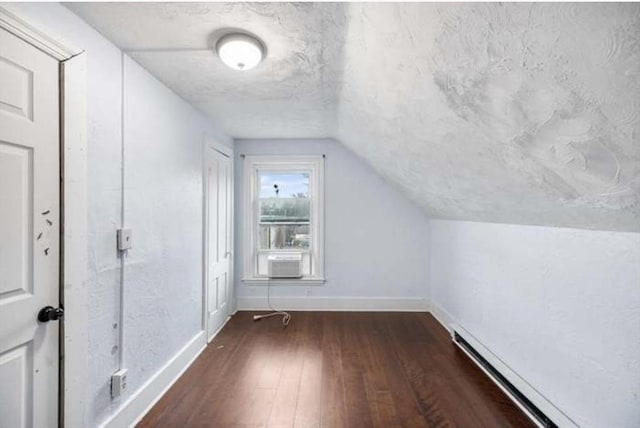 629 Cambridge St, Worcester, MA 01610 - additional living space with hardwood / wood-style floors, baseboards, a baseboard heating unit, cooling unit, and vaulted ceiling