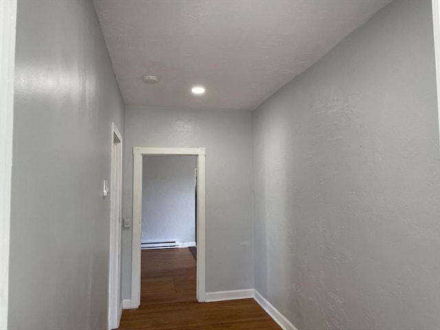 629 Cambridge St, Worcester, MA 01610 - hall featuring dark wood-style flooring, a baseboard heating unit, baseboards, and recessed lighting