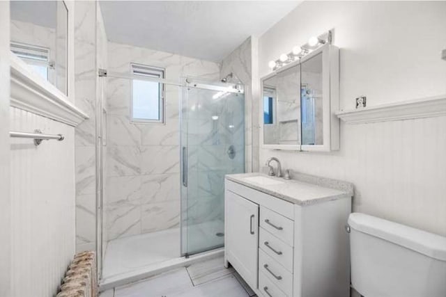 629 Cambridge St, Worcester, MA 01610 - full bathroom featuring toilet, a marble finish shower, vanity, and radiator