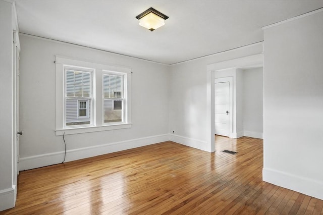 unfurnished room featuring wood-type flooring