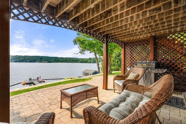 view of patio / terrace featuring a water view and outdoor lounge area