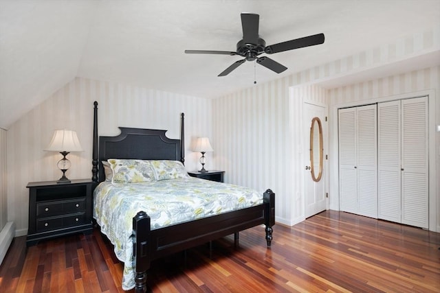 bedroom with wallpapered walls, wood finished floors, baseboards, a ceiling fan, and lofted ceiling