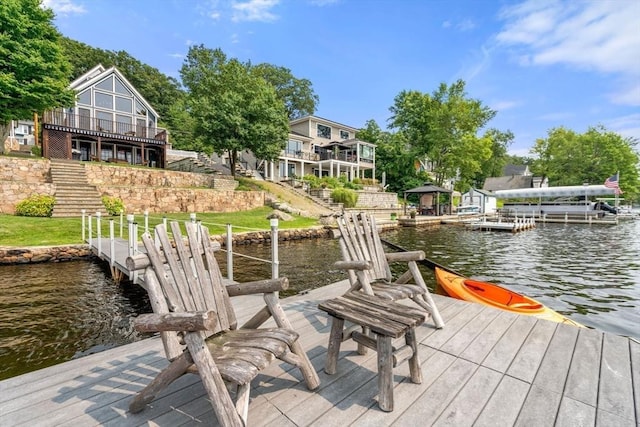 dock area with a water view and stairs