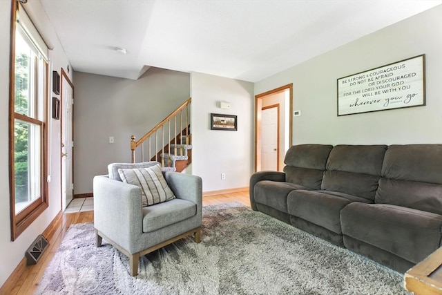 150 Hillside Rd Unit 2, Westfield, MA 01085 - living area with plenty of natural light, stairway, light wood-type flooring, and baseboards