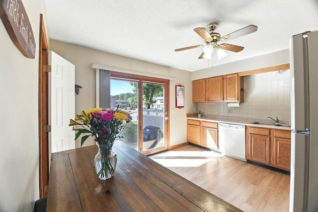 150 Hillside Rd Unit 2, Westfield, MA 01085 - kitchen with dishwasher, light wood finished floors, light countertops, a sink, and ceiling fan