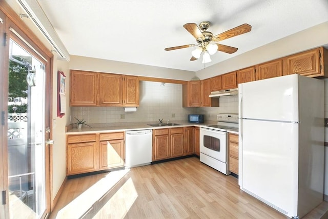 150 Hillside Rd Unit 2, Westfield, MA 01085 - kitchen featuring white appliances, light countertops, under cabinet range hood, and backsplash
