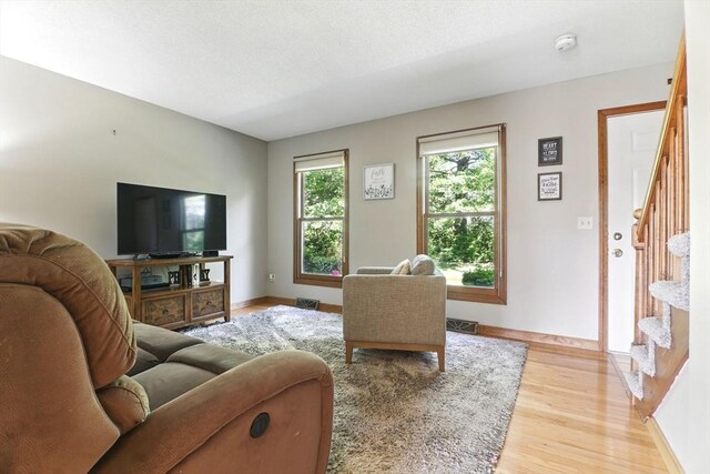 150 Hillside Rd Unit 2, Westfield, MA 01085 - living area with stairs, light wood finished floors, and baseboards