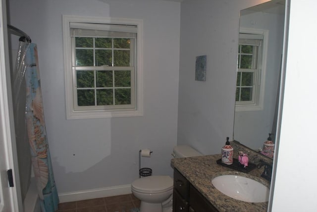 11 Rockingham Dr Unit 11, Tewksbury, MA 01876 - full bath featuring vanity, baseboards, toilet, curtained shower, and tile patterned floors