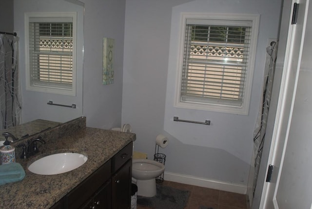 11 Rockingham Dr Unit 11, Tewksbury, MA 01876 - bathroom with toilet, vanity, tile patterned flooring, baseboards, and curtained shower