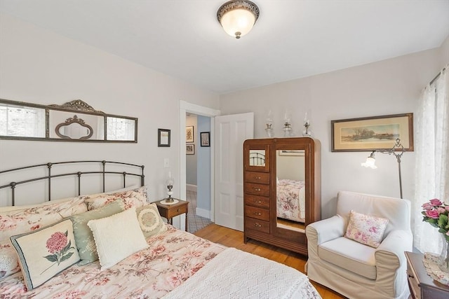 bedroom featuring wood finished floors