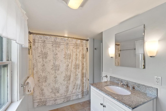 full bath with vanity and shower / bath combo