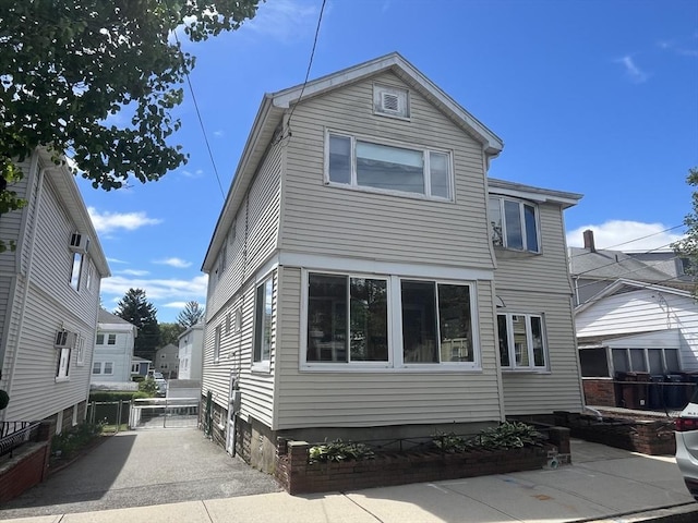 view of home's exterior featuring fence