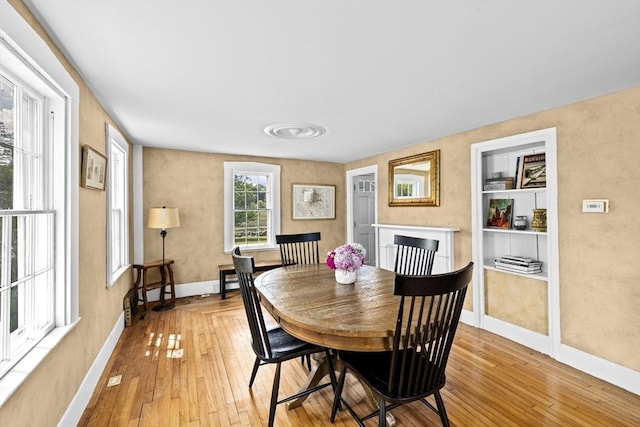 112 Hollett St, Scituate, MA 02066 - dining space featuring light wood-style floors and baseboards
